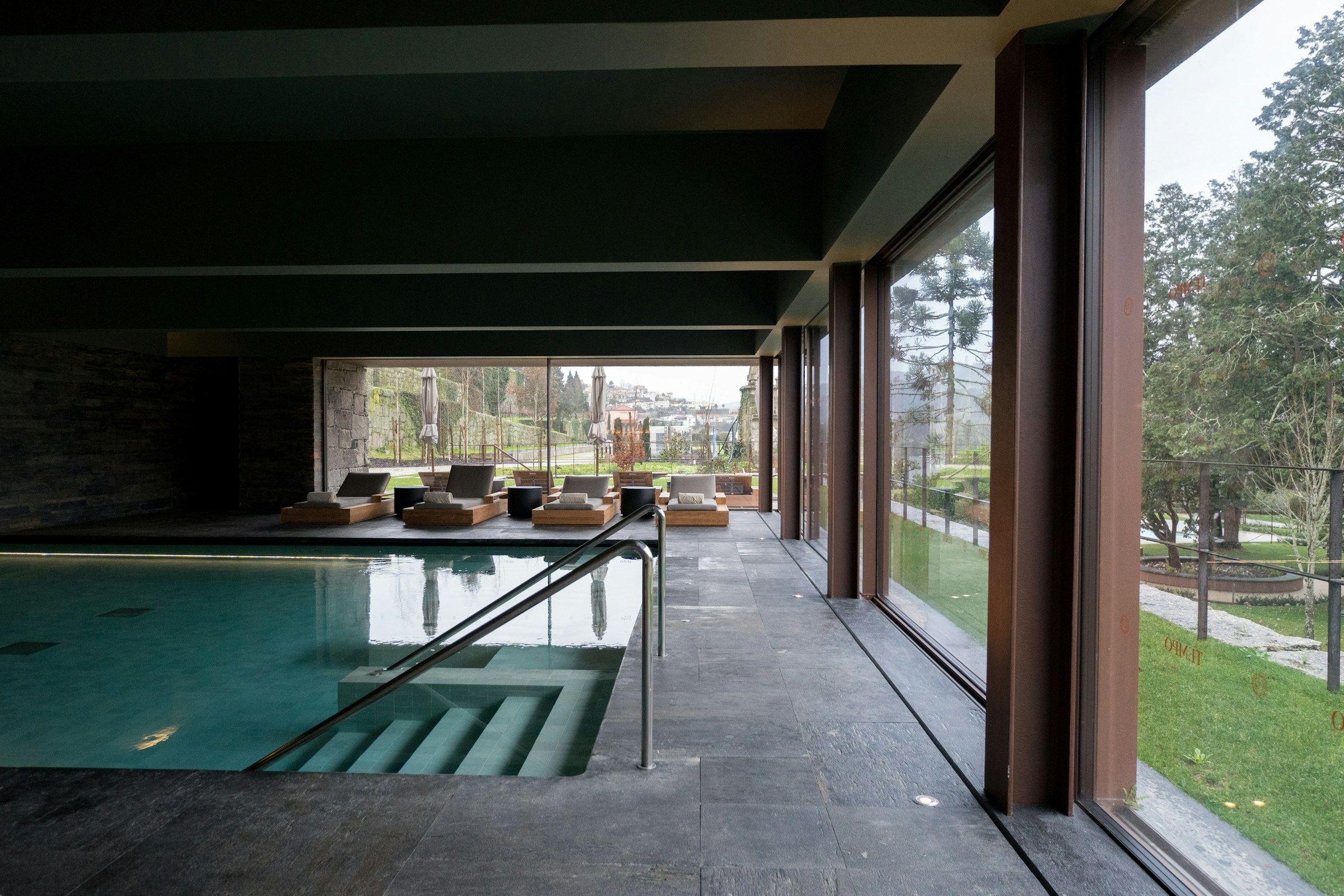 Indoor pool with garden view