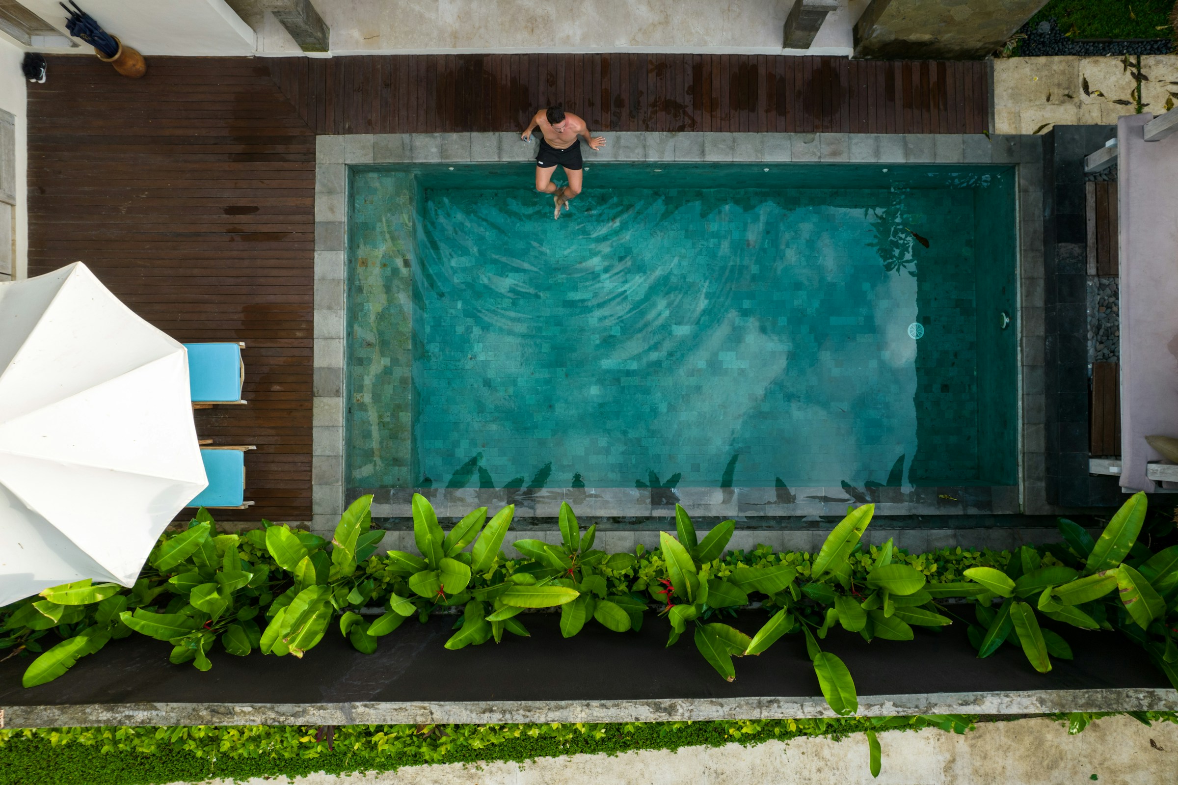 Aerial view of swimmer entering pool