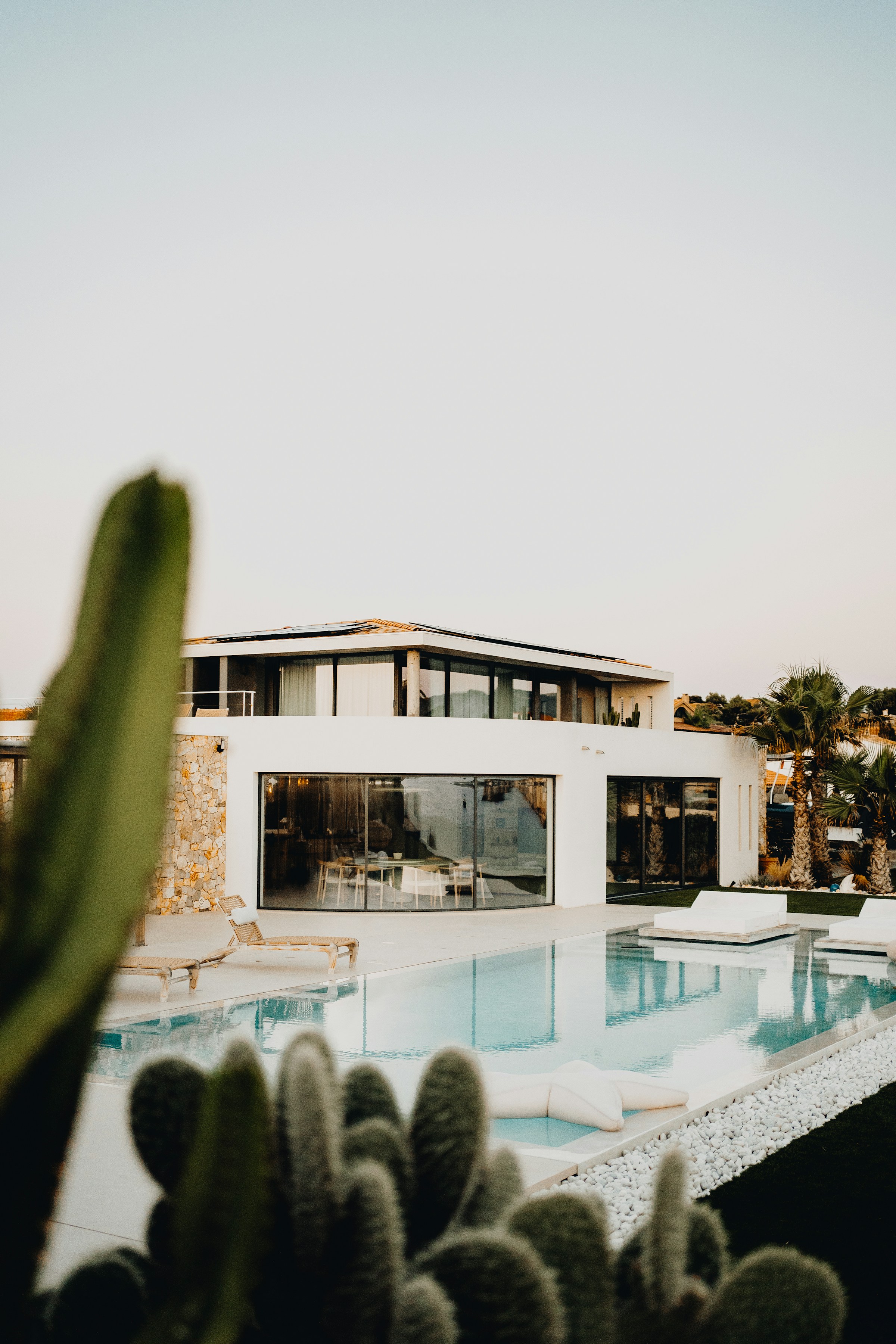 Rooftop pool at sunset overlooking the city